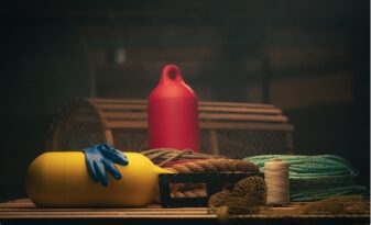 Marine gear including rope, gloves, buoy, and fishing equipment for coastal fishing