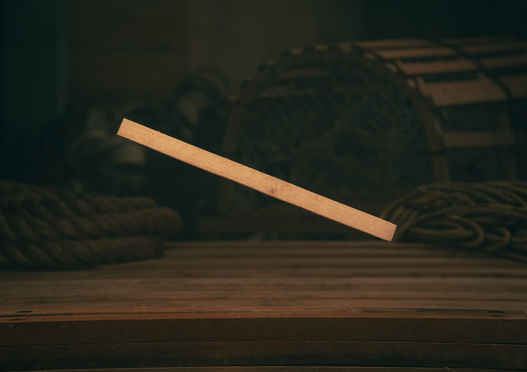 Wood trap divider used to secure netting inside lobster traps