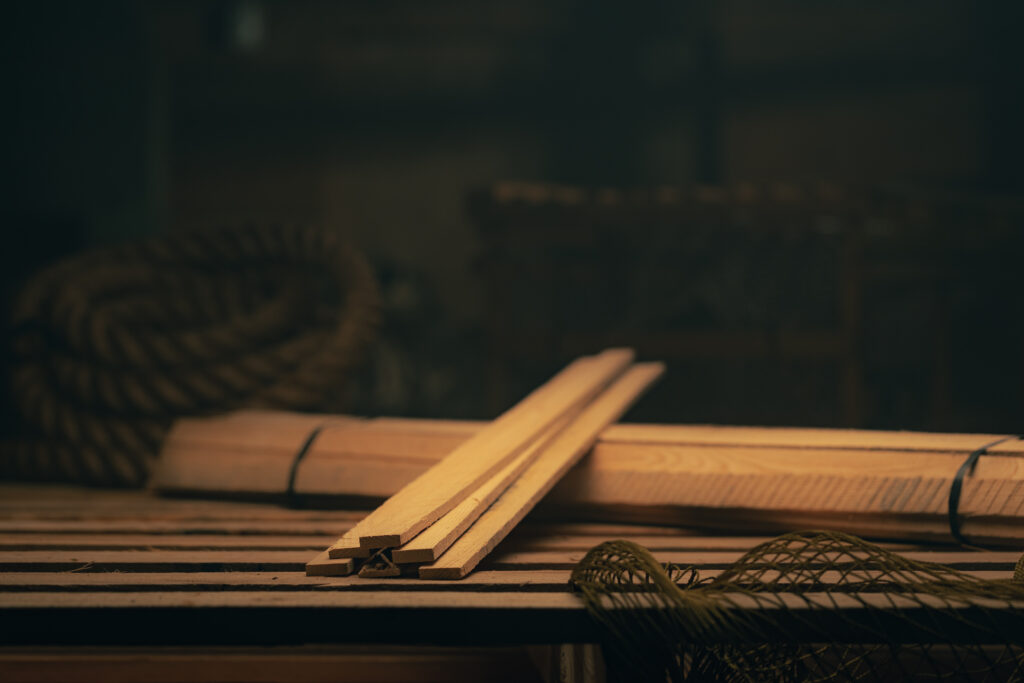 Wooden laths used in lobster trap construction for structural support and durability