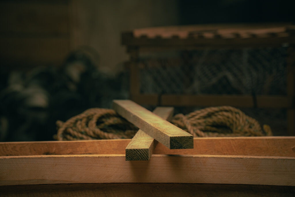 Wooden ballast laths used in lobster trap construction for strength and stability